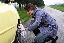 Defective Tires woman checking tire