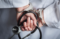 Healthcare fraud doctor handcuffs thumb